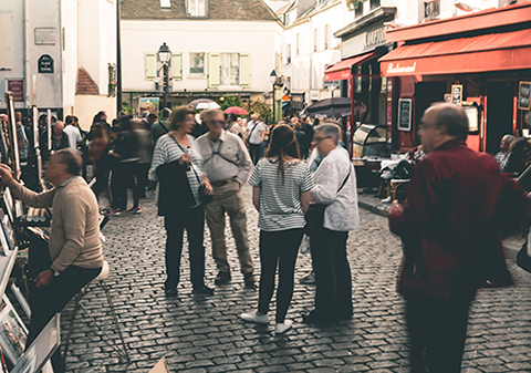 People in a crowded european market