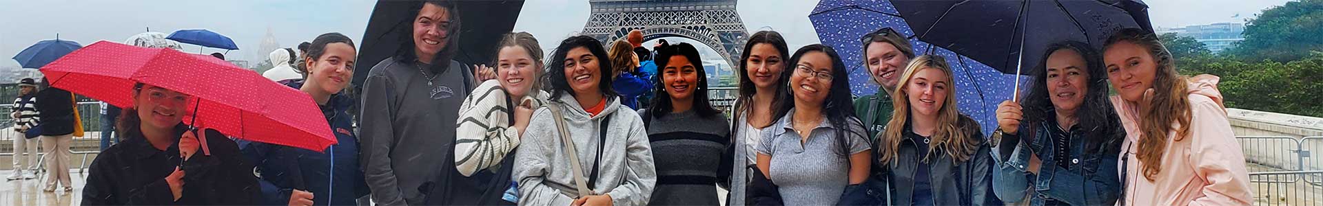 UF Students in front of the Eiffel Tower
